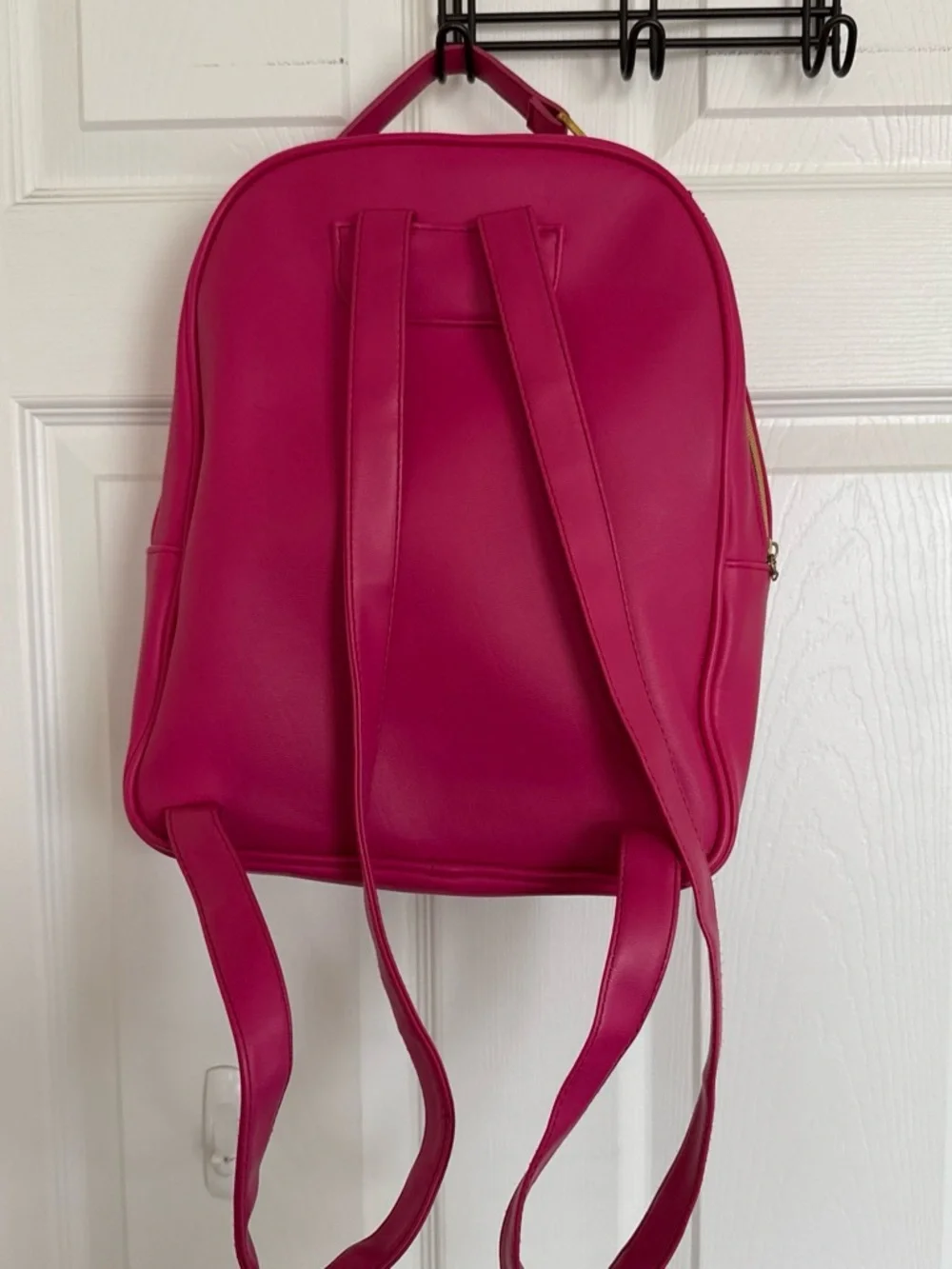 Women's Juicy Couture Hot Pink and Black Sequin backpack with gold detailing.
